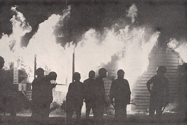 Police in front of the burning ROTC building at Washington University.